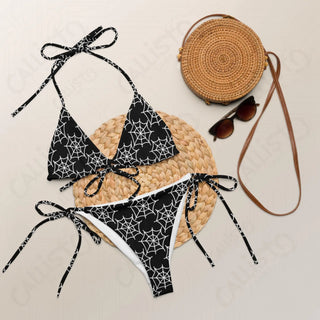 Women’s Bikinis featuring a close up of a bikini, straw bag, and sunglasses