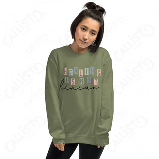 Woman wearing green sweatshirt with words ’’ displayed - Women’s Mental Health collection.