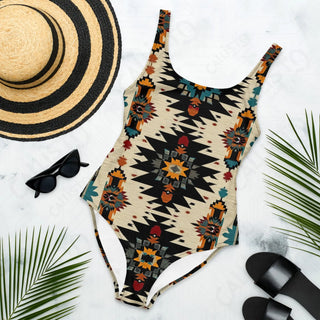 Women’s one-piece swimsuit with matching hat and sunglasses for a stylish beach look.